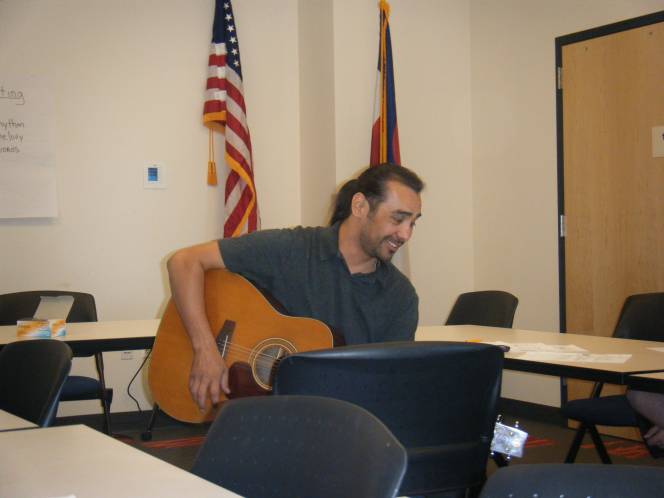 Richie Castro teaching teens songwriting at Anythink Commerce City